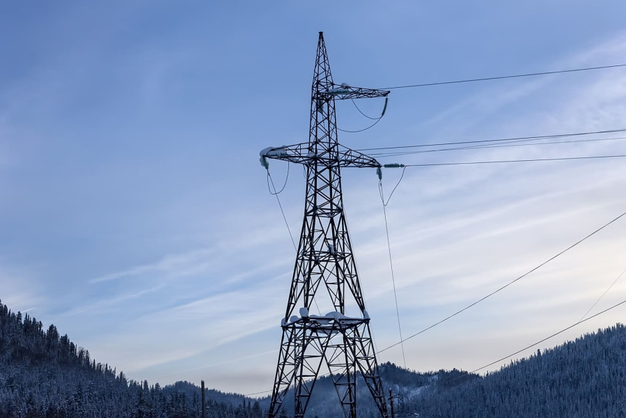 electric-tower-in-winter-on-the-background-of-snowy-mountains-power-electricity-energy-tower-sky_t20_pRRGJe (1) (1)-1